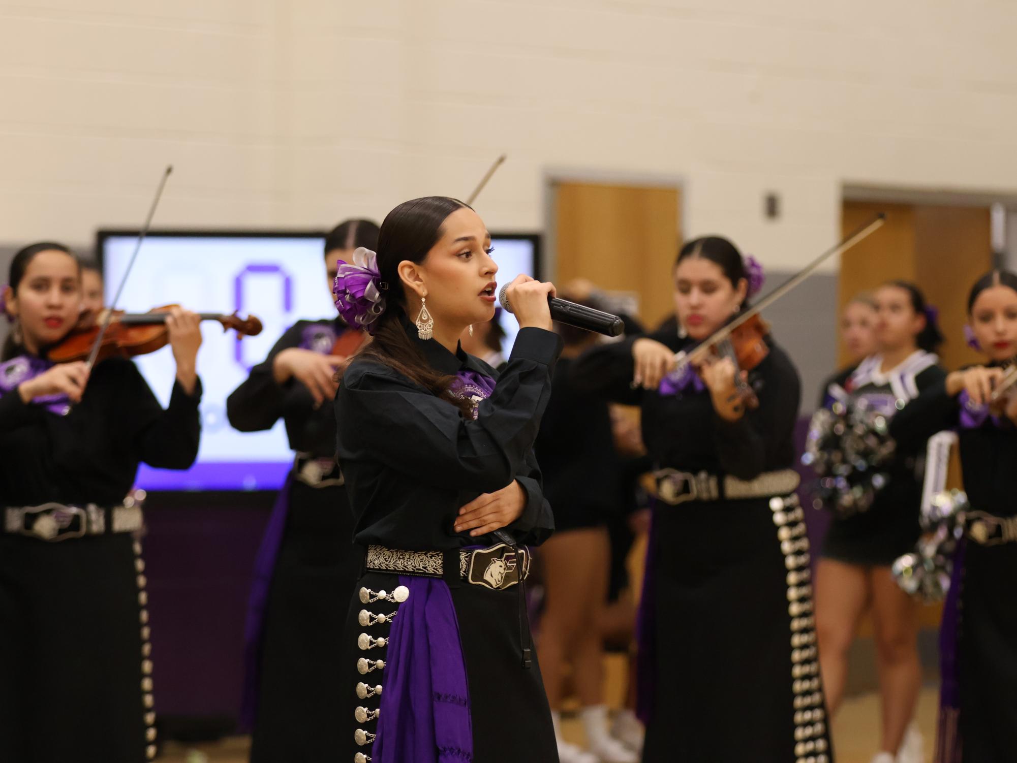 Mariachi Estrella del Oeste performs the National Anthem during a volleyball game on Sept. 3, in the magnet gym. 